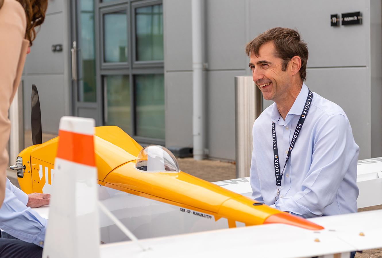 Flylogic CEO Charles Tavner with BVLOS plane with Cambridge Consultants team