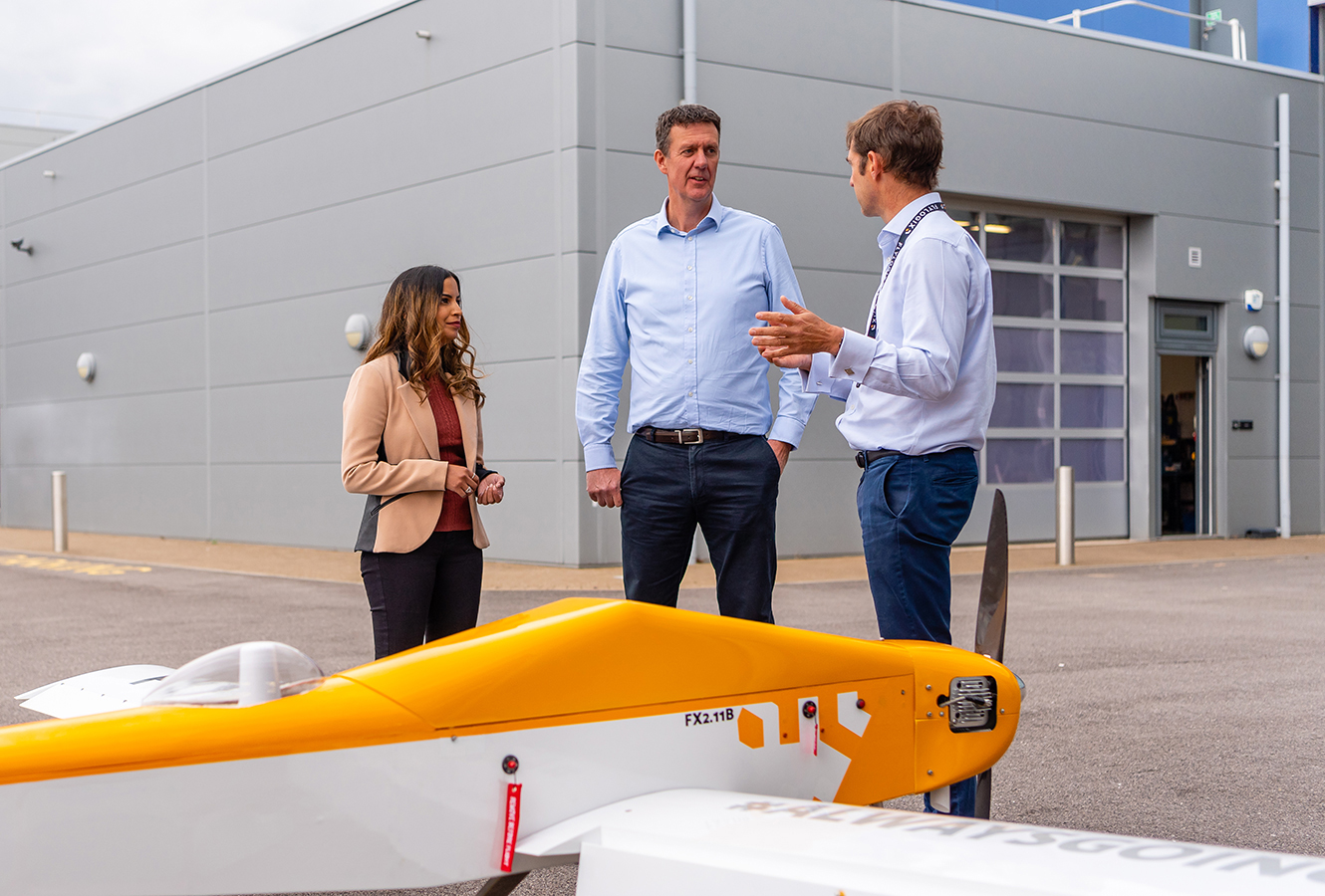 Flylogix CEO Charles Tavner with Cambridge Consultants team next to BVLOS drone