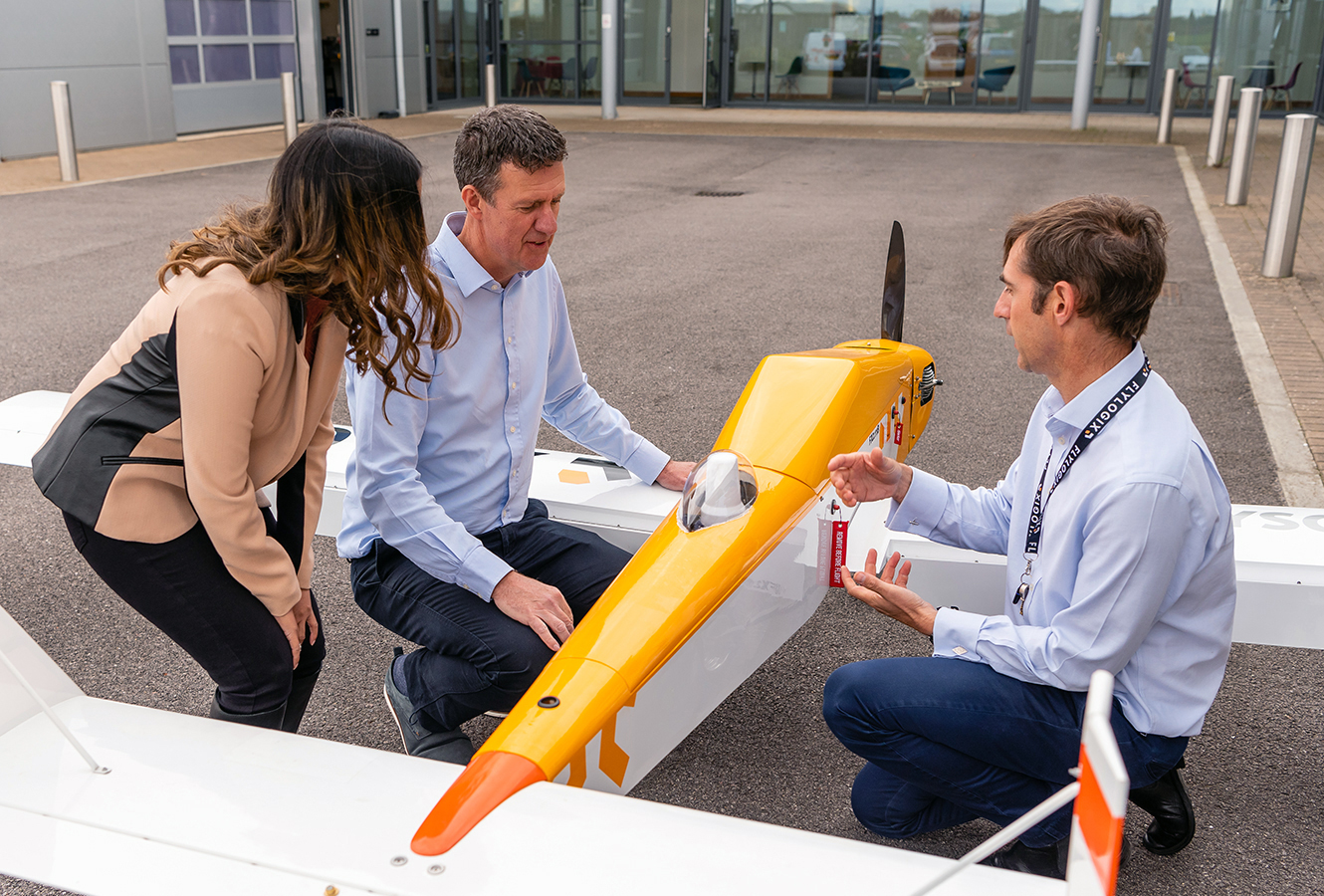 Flylogix CEO Charles Tavner with Cambridge Consultants team next to BVLOS drone