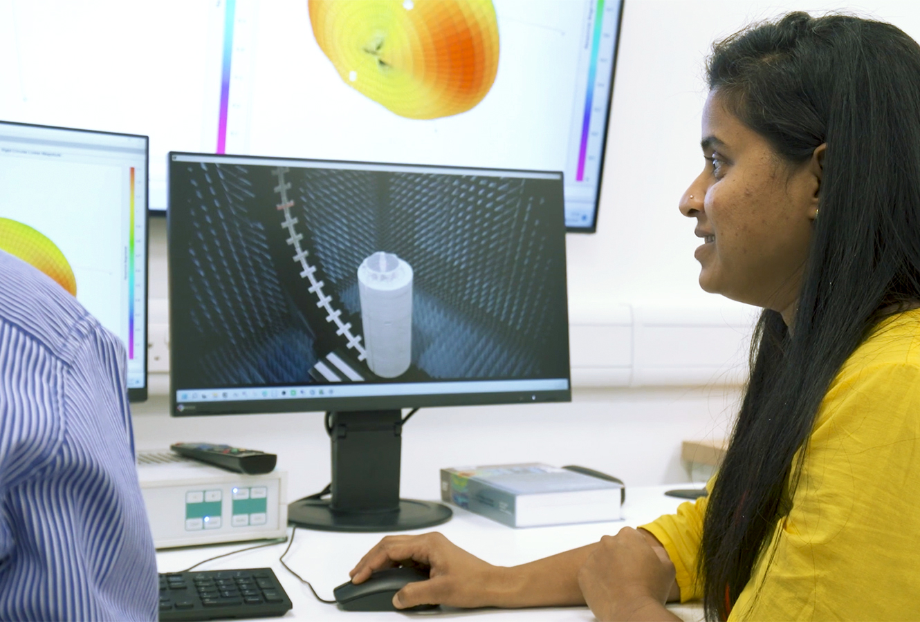 Cambridge Consultants engineers monitoring performance in anechoic test chamber